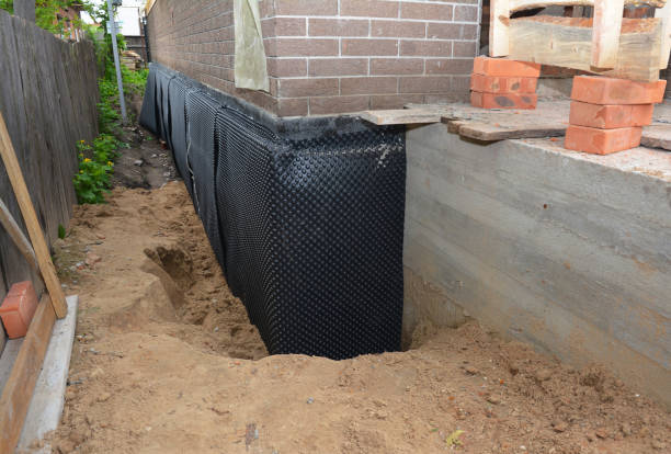 Happy homeowners after waterproofing job in Hixson